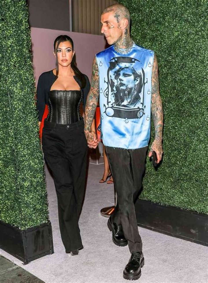 
Kourtney Kardashian Preps for Travis Barker’s Blink-182 in Black Fishnet Dress: ‘Ready to Mosh’ 